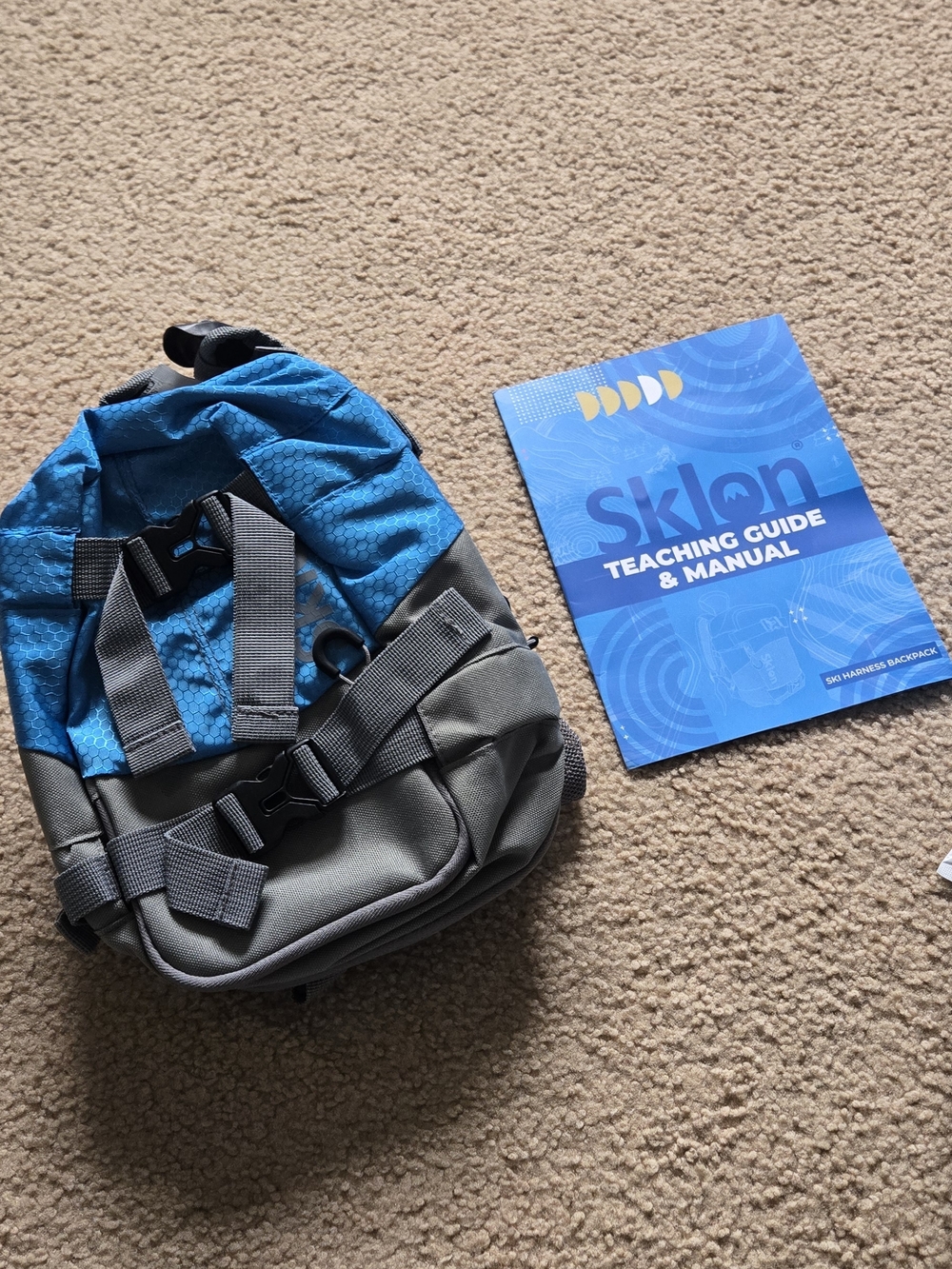 Sklon gray drawstring pouch with blue guide booklet